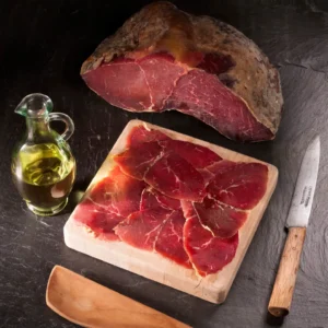 Whole 1 kg piece of Spanish Cecina, showcasing its deep red cured beef texture.