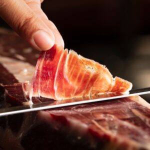 100% Ibérico Bellota Ham – premium Spanish acorn-fed ham with rich marbling and artisan natural curing.
