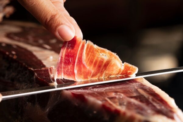100% Ibérico Bellota Ham – premium Spanish acorn-fed ham with rich marbling and artisan natural curing.