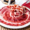 100% Ibérico Bellota Ham – premium Spanish acorn-fed ham with rich marbling and artisan natural curing.