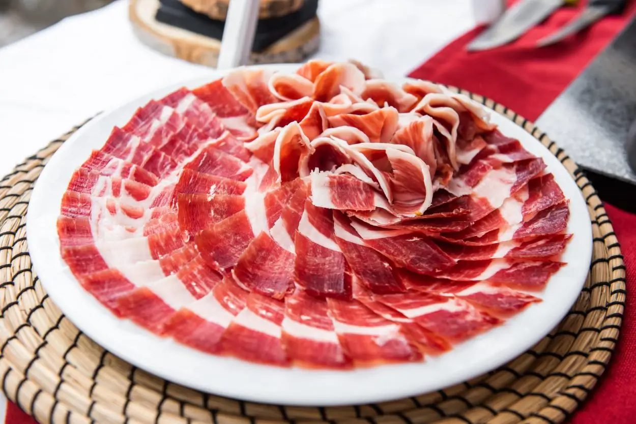 100% Ibérico Bellota Ham – premium Spanish acorn-fed ham with rich marbling and artisan natural curing.