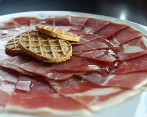 Serrano Ham sliced. The delicious essence of Spanish flavor