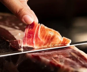 100% Ibérico Bellota Ham – premium Spanish acorn-fed ham with rich marbling and artisan natural curing.